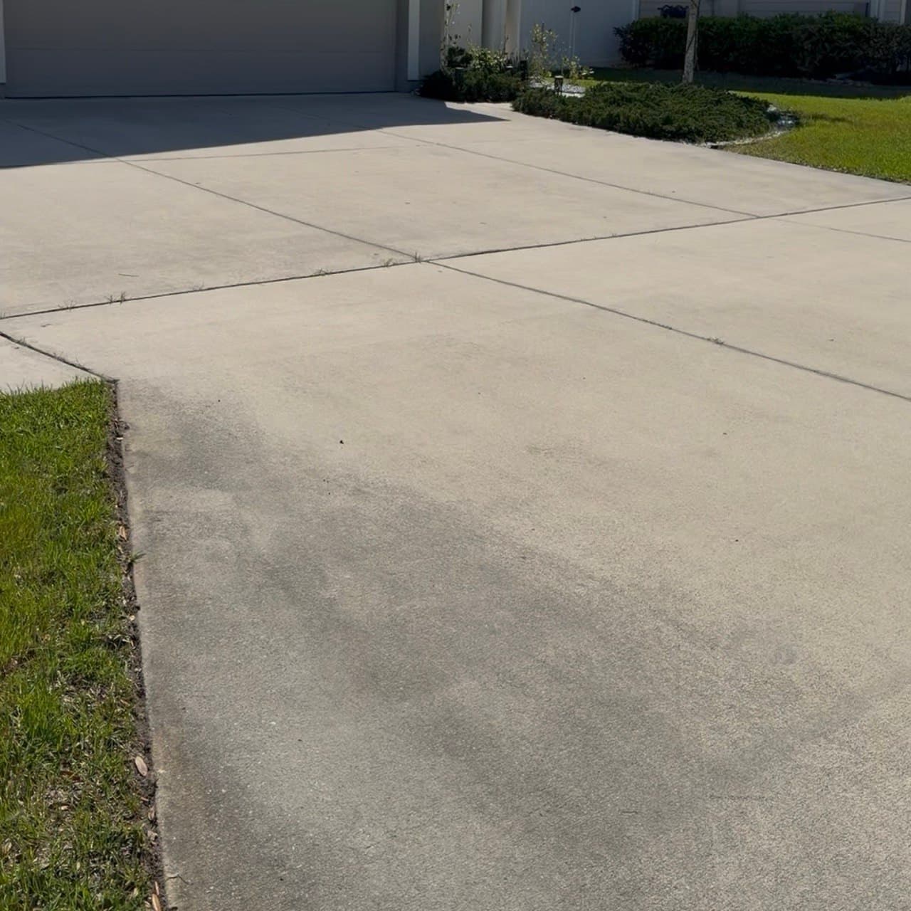 Oil stain and dirt removal from driveway before and after