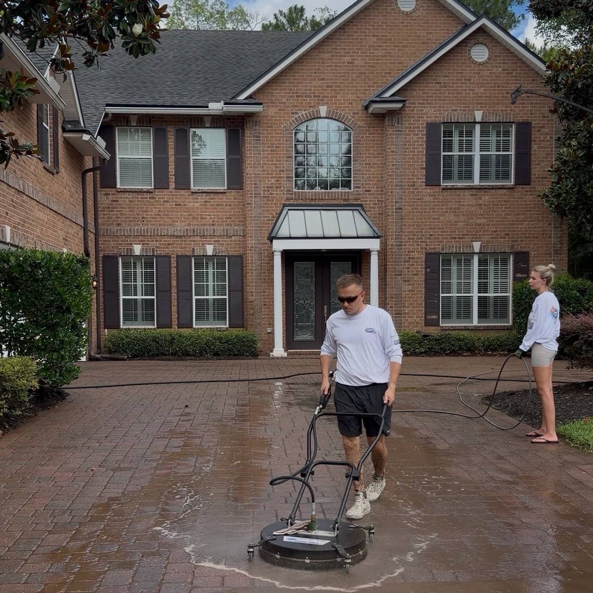 Before and after driveway pressure washing in Jacksonville, FL