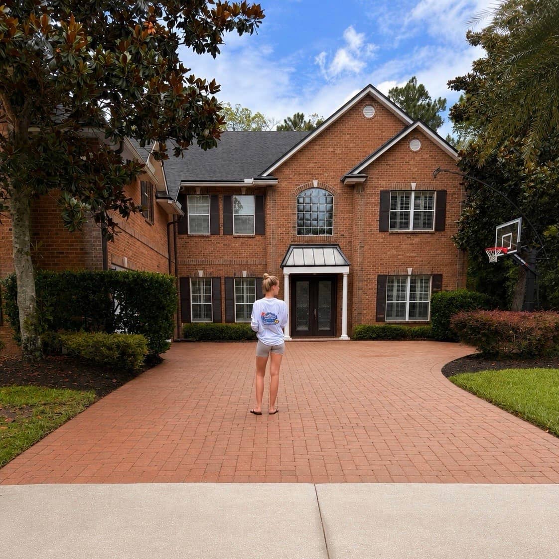 Concrete driveway cleaning transformation in Jacksonville